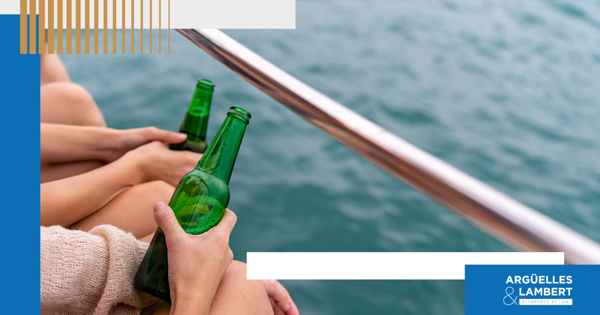 Two people with alcohol bottles on a boat referencing Boating While Intoxicated (BWI) laws and penalties